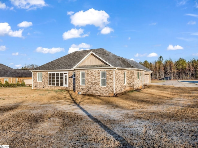 exterior space with brick siding