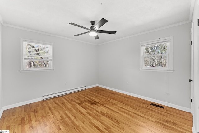 spare room with a baseboard heating unit, crown molding, a ceiling fan, and light wood finished floors