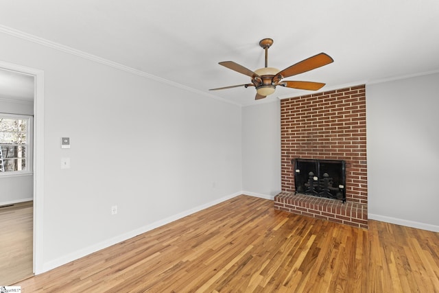 unfurnished living room with wood finished floors, ceiling fan, and ornamental molding