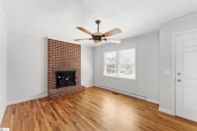 unfurnished living room featuring ornamental molding, a ceiling fan, wood finished floors, a baseboard radiator, and a brick fireplace