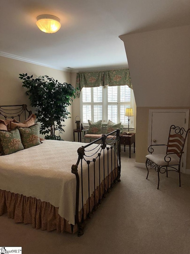 bedroom featuring light carpet and crown molding