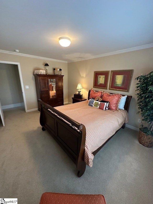 bedroom featuring crown molding, baseboards, and light carpet