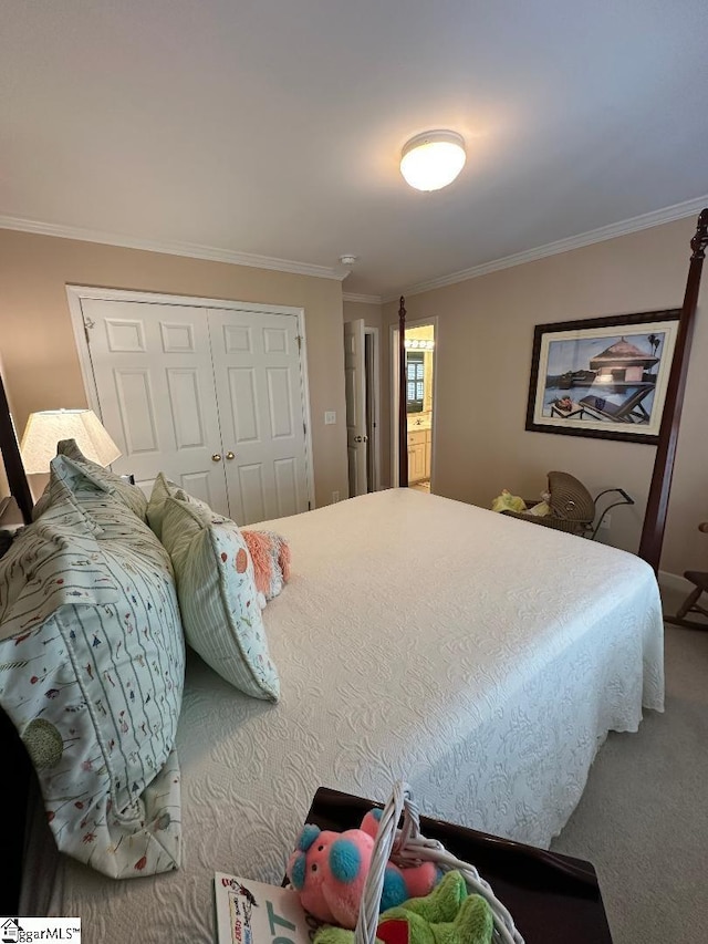 bedroom with a closet, carpet, and ornamental molding