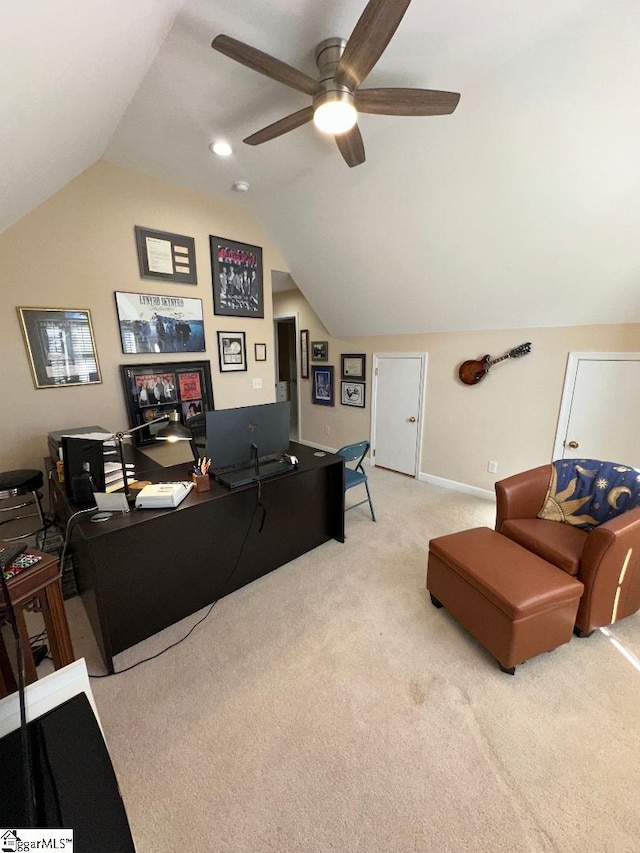 carpeted living area with baseboards, lofted ceiling, and a ceiling fan