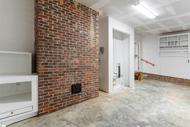 below grade area featuring brick wall