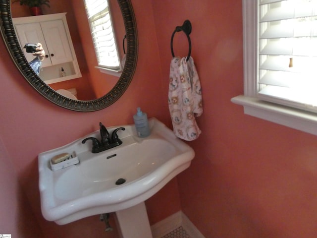 bathroom with a sink and a healthy amount of sunlight