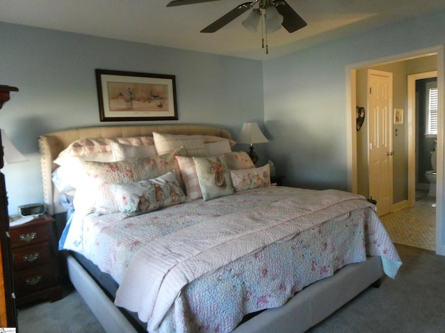 bedroom with a ceiling fan and carpet