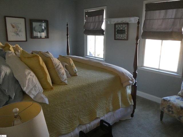 bedroom featuring carpet and baseboards