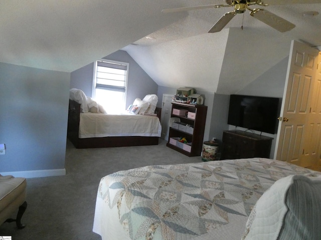 carpeted bedroom featuring vaulted ceiling, a ceiling fan, baseboards, and a textured ceiling