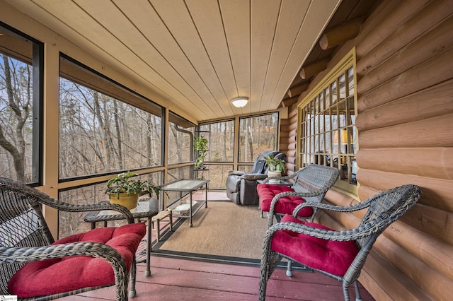 sunroom / solarium featuring wooden ceiling