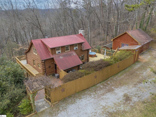 drone / aerial view featuring a wooded view