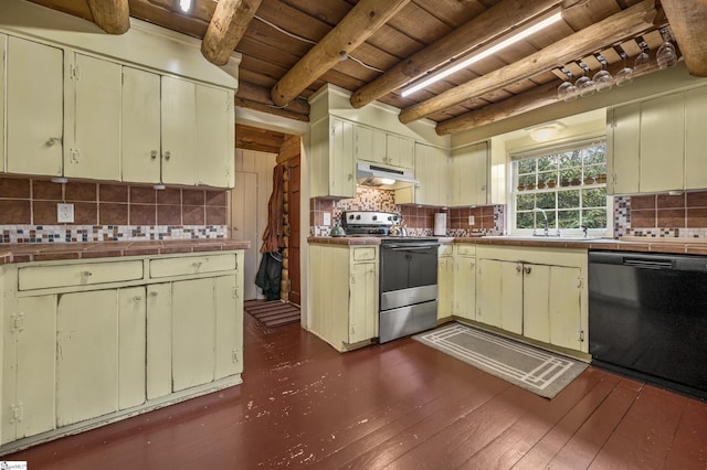 kitchen with tile countertops, electric stove, under cabinet range hood, and black dishwasher