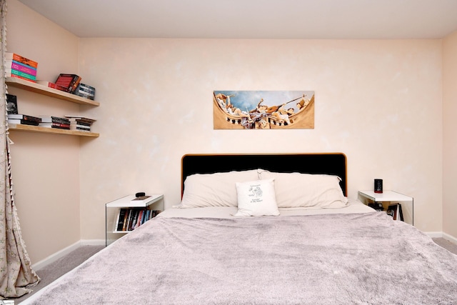 carpeted bedroom with baseboards