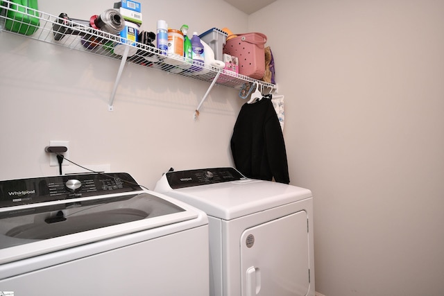 laundry room with washer and clothes dryer and laundry area