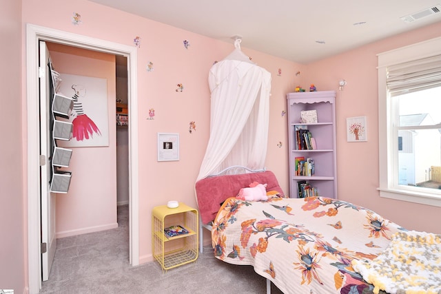 bedroom with visible vents, baseboards, and carpet