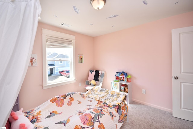 bedroom featuring visible vents, carpet floors, and baseboards