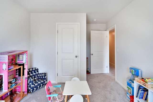 playroom with baseboards and carpet flooring