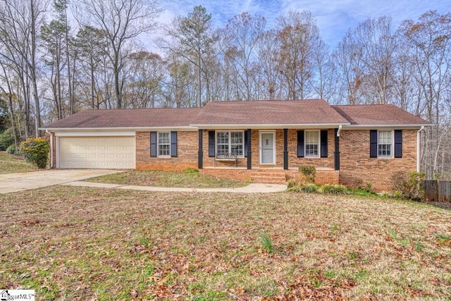 ranch-style house with a porch, concrete driveway, an attached garage, and brick siding