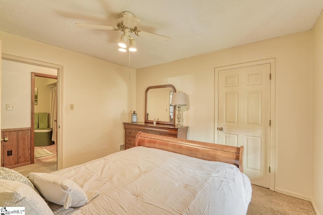 bedroom featuring a textured ceiling, ceiling fan, and carpet flooring