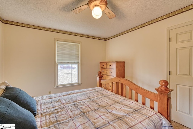 bedroom featuring a textured ceiling and ceiling fan