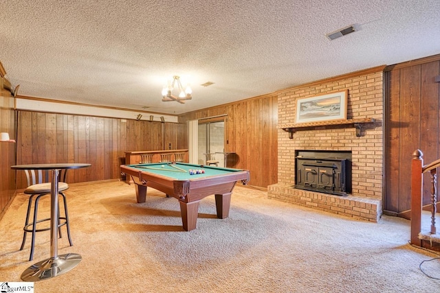 rec room with visible vents, light colored carpet, wood walls, and billiards