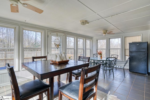 dining space featuring plenty of natural light, a ceiling fan, and tile patterned flooring