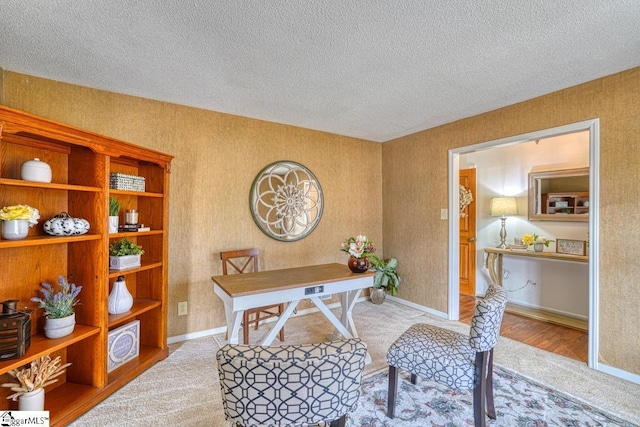 office featuring a textured ceiling and baseboards