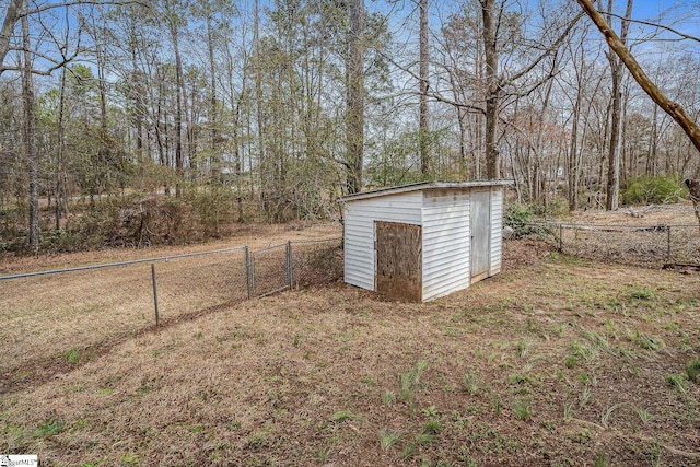 view of shed featuring fence