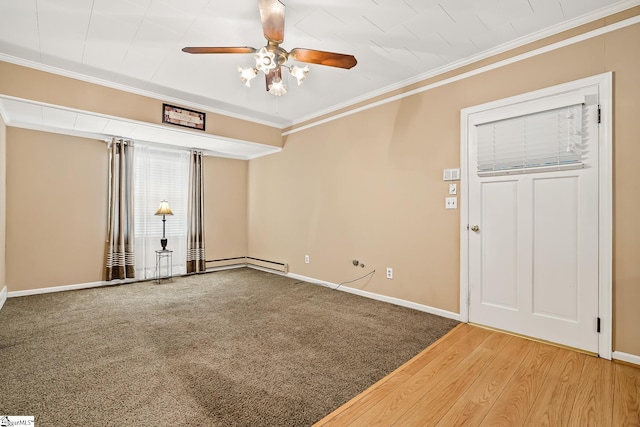 spare room with crown molding, carpet flooring, baseboards, and ceiling fan