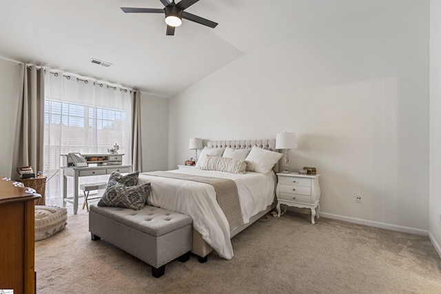 carpeted bedroom with visible vents, a ceiling fan, baseboards, and vaulted ceiling