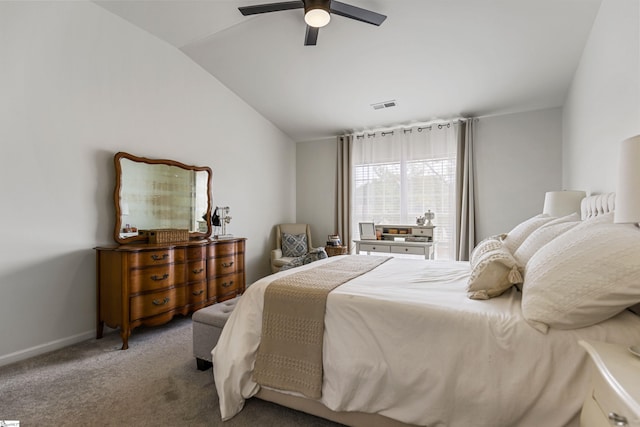 carpeted bedroom with vaulted ceiling, a ceiling fan, visible vents, and baseboards