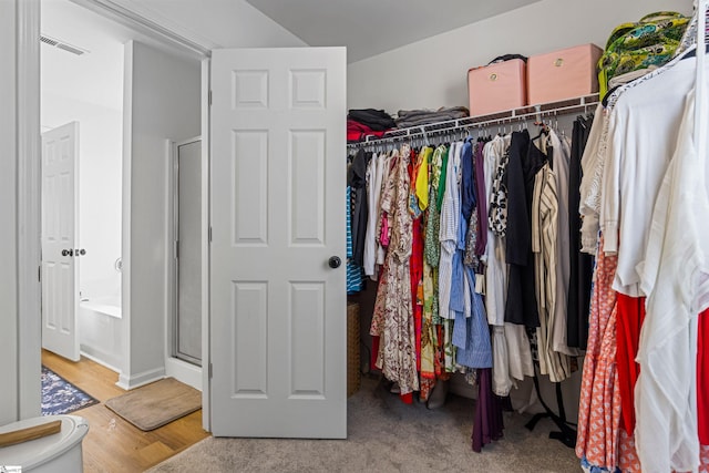 spacious closet with visible vents and wood finished floors