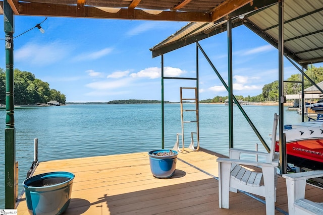 view of dock featuring boat lift and a water view