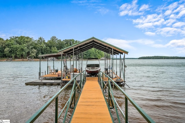 view of dock with boat lift and a water view