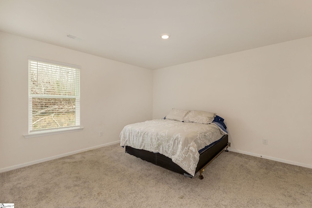 carpeted bedroom featuring recessed lighting and baseboards