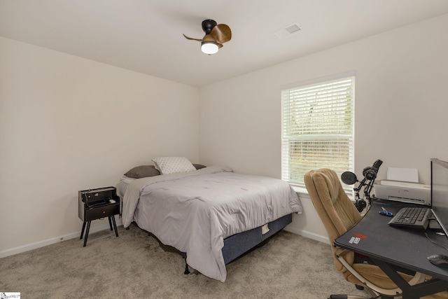 bedroom with visible vents, baseboards, and carpet flooring