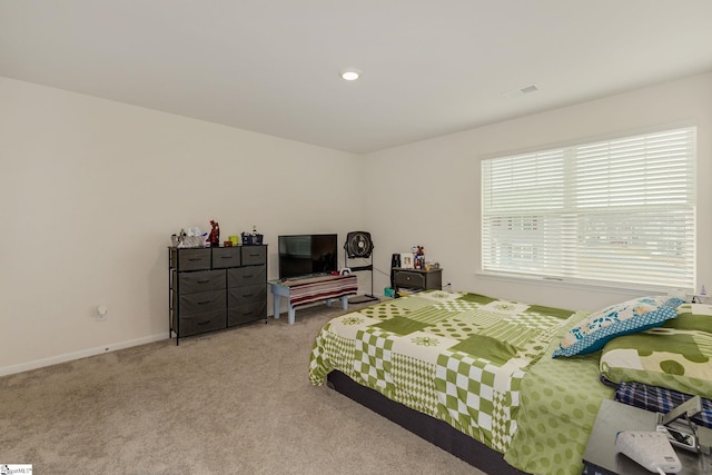 carpeted bedroom featuring recessed lighting, visible vents, and baseboards