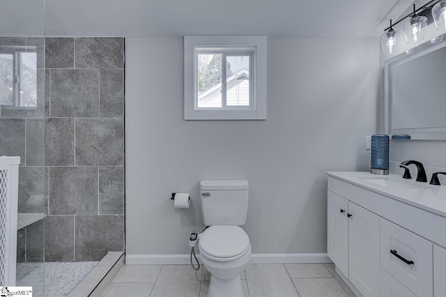 full bath with baseboards, toilet, a walk in shower, and tile patterned flooring