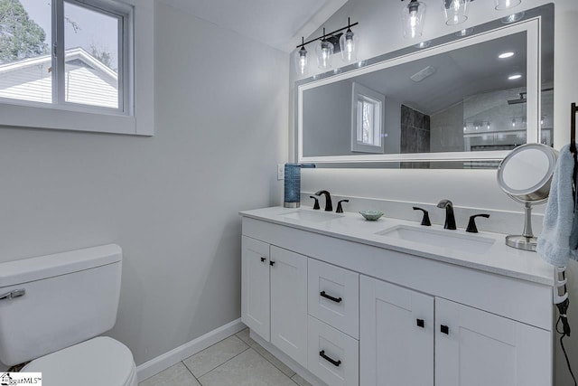 full bath with vaulted ceiling, toilet, and a sink