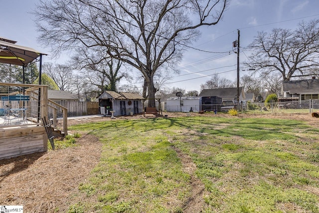 view of yard featuring an outbuilding and a fenced backyard