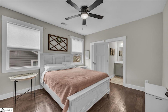 bedroom featuring dark wood finished floors, baseboards, visible vents, and ceiling fan