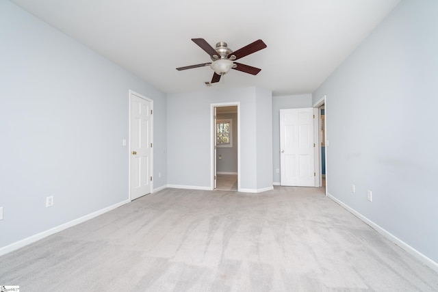 unfurnished bedroom featuring carpet flooring, a ceiling fan, and baseboards