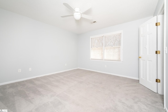 interior space featuring a ceiling fan, carpet flooring, baseboards, and visible vents