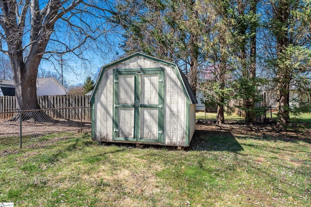 view of shed with a fenced backyard