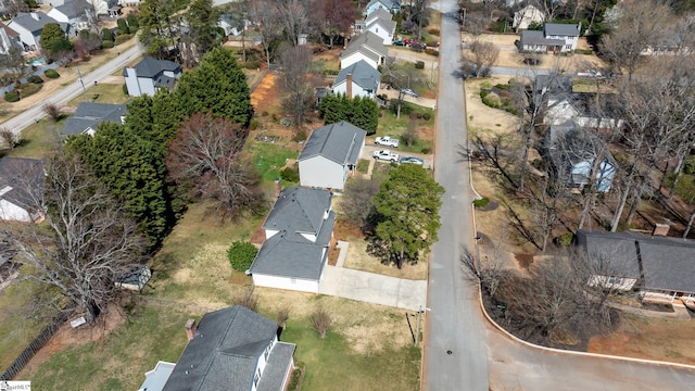 birds eye view of property with a residential view