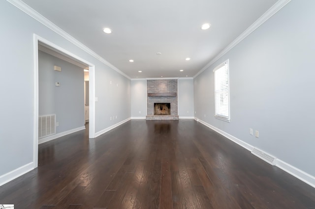 unfurnished living room with dark wood-type flooring, crown molding, baseboards, and visible vents