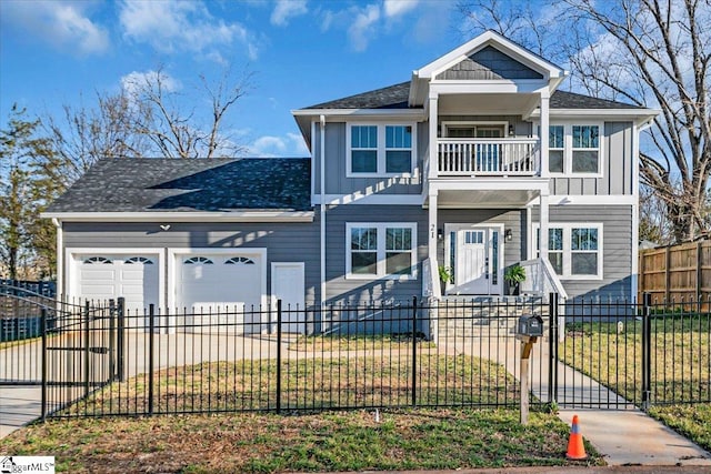 view of front of house with a fenced front yard, a balcony, concrete driveway, and an attached garage