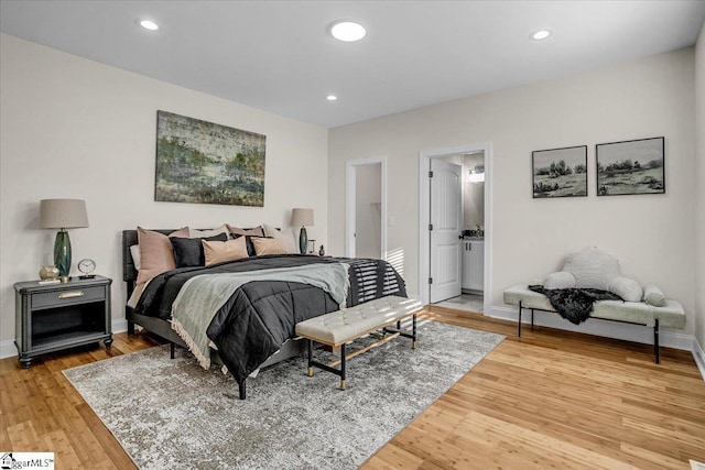 bedroom featuring recessed lighting, baseboards, and light wood-style floors