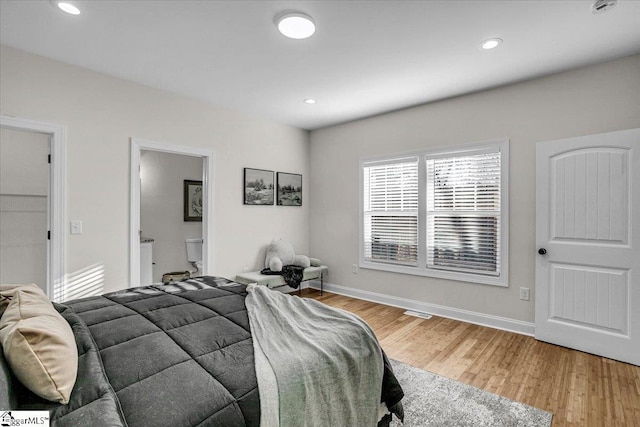 bedroom with recessed lighting, baseboards, and light wood finished floors