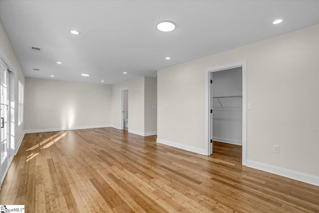 unfurnished room featuring recessed lighting, visible vents, baseboards, and light wood finished floors